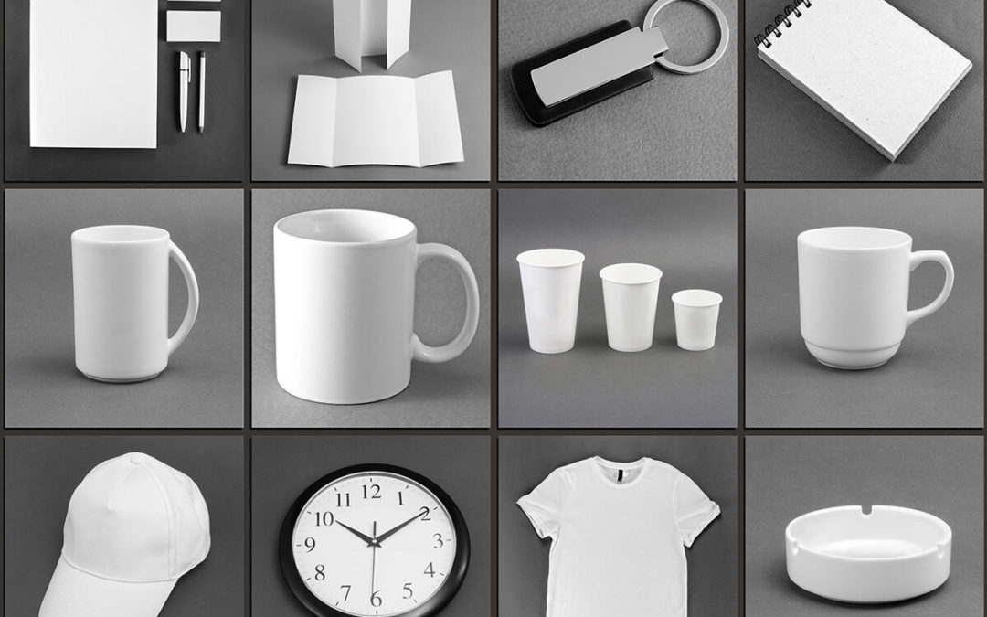 Collage of various blank promotional items including mugs, t-shirts, hats, notebooks, and a clock, all displayed on a gray.